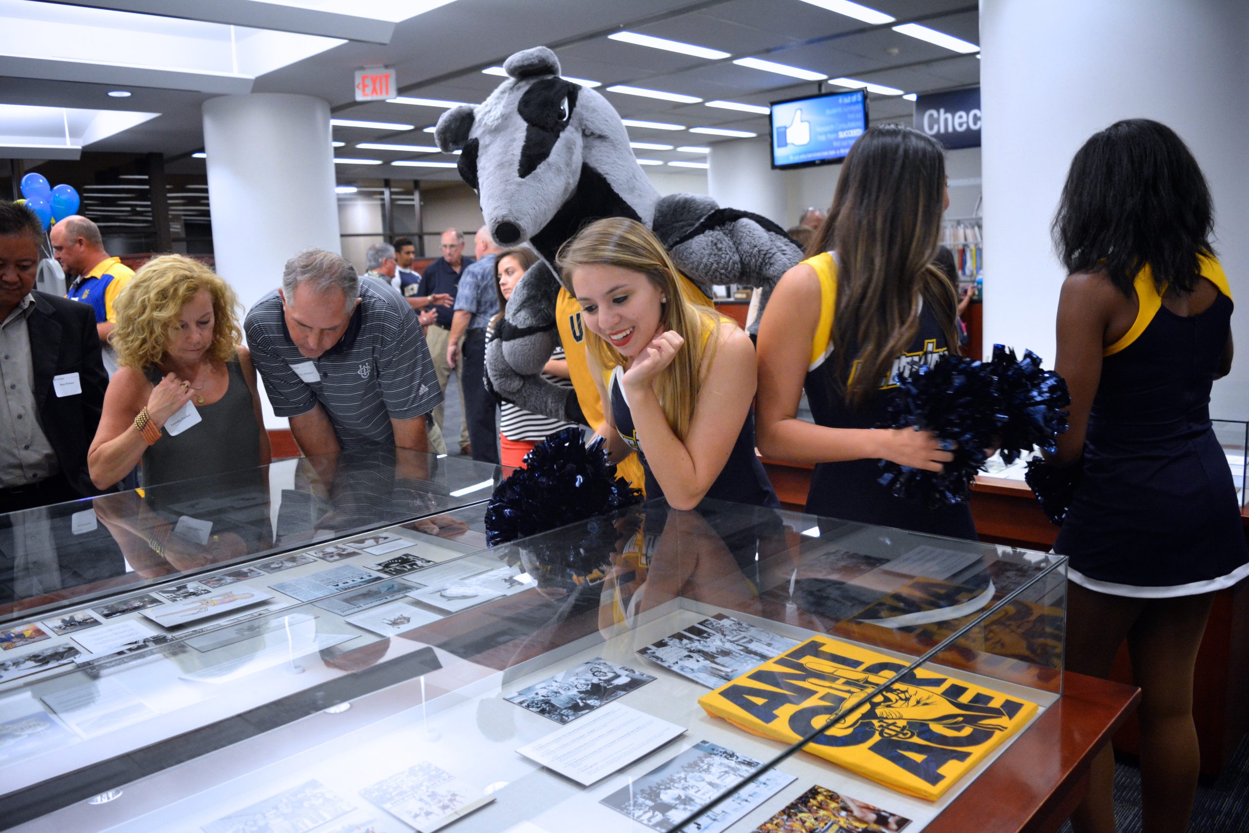 group of people looking at exhibit